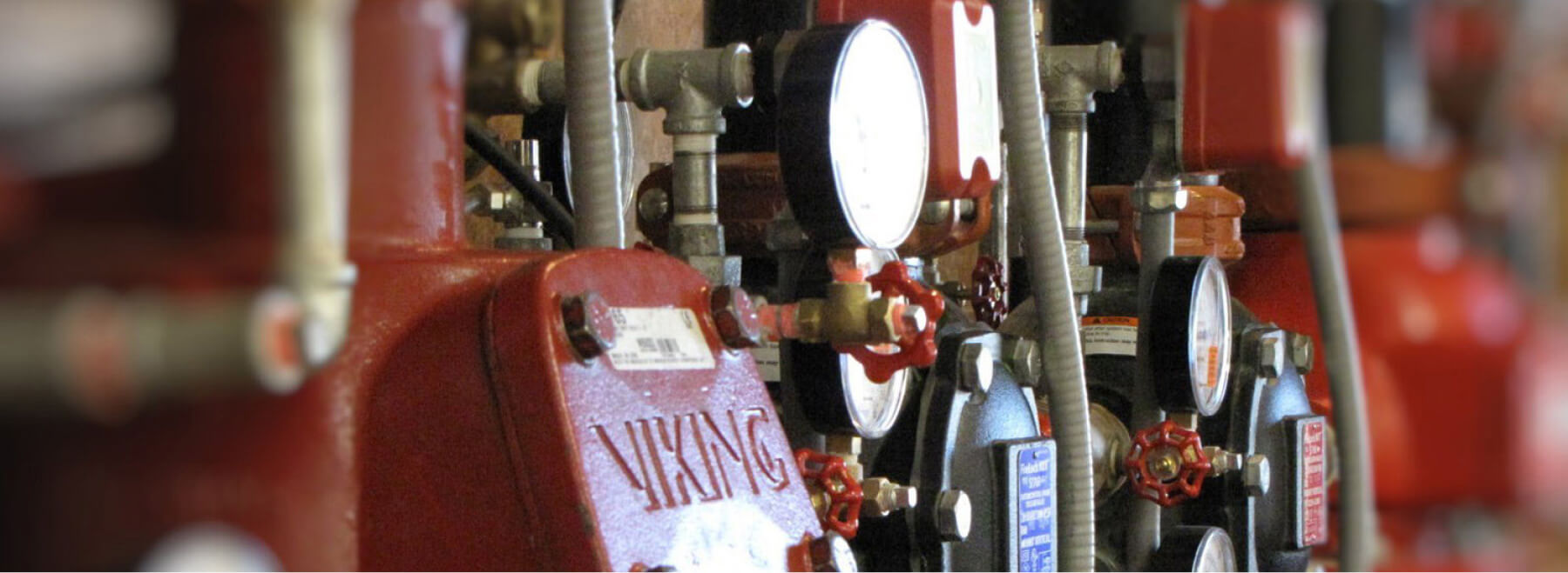 Red water pipes with pressure gauges