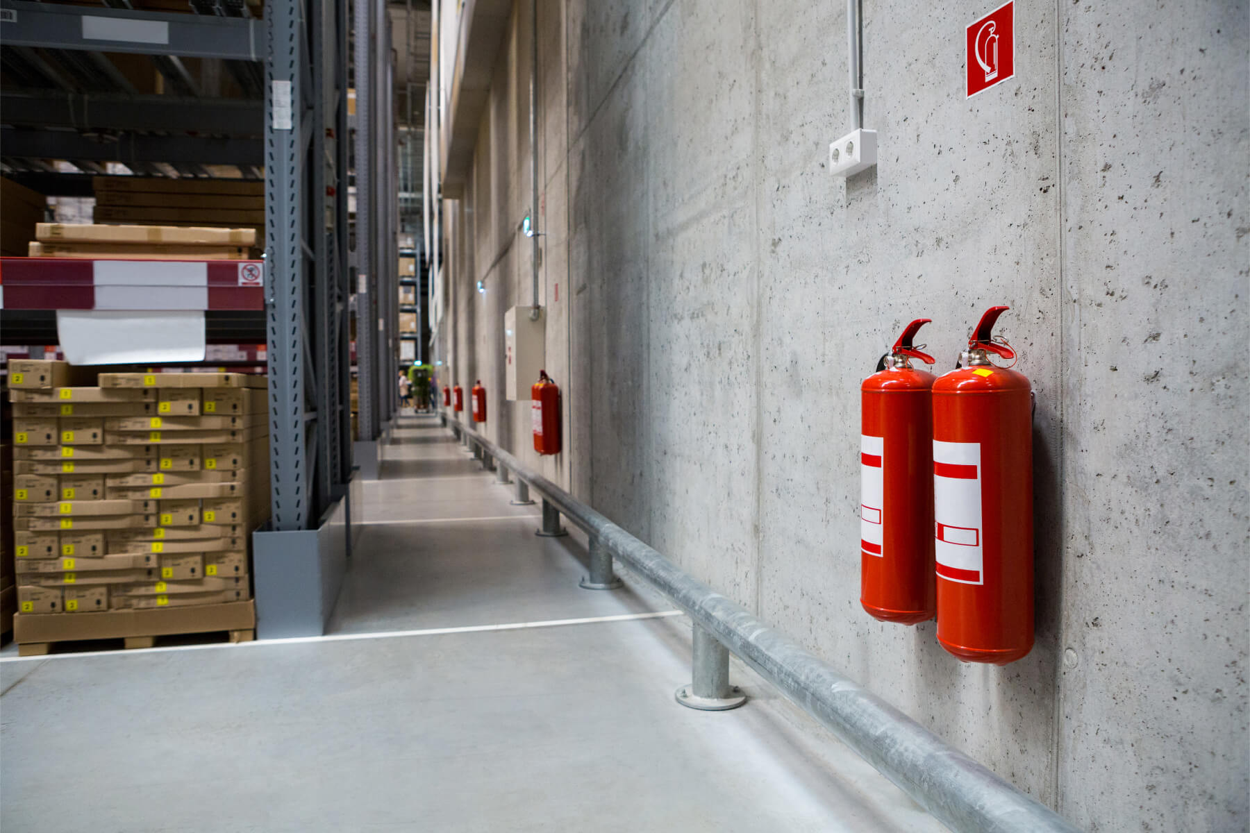 Warehouse hallways with two fire extinguishers