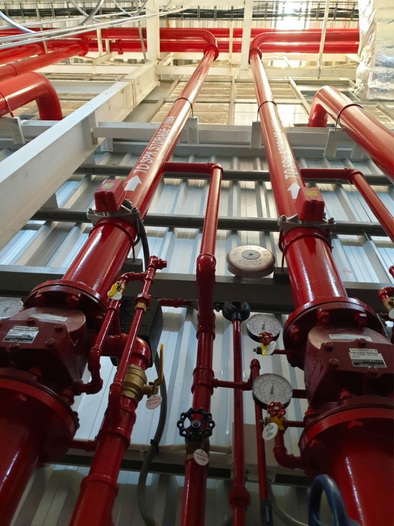 Tall water pipes in a warehouse
